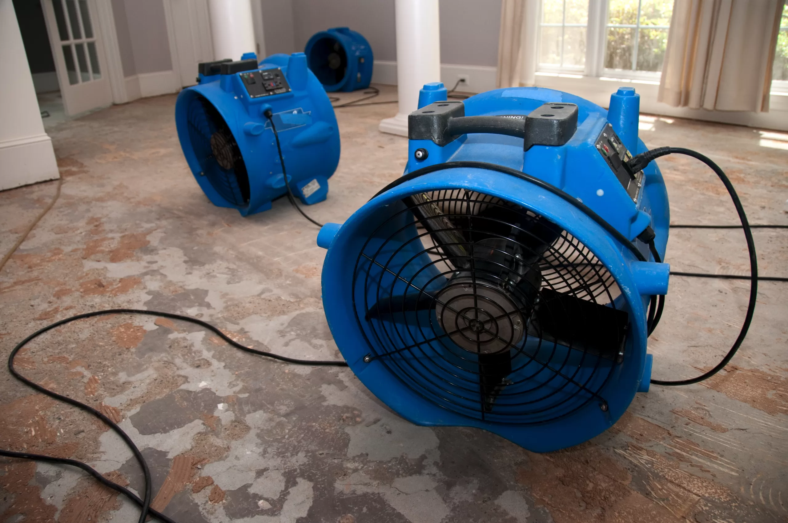 drying out a house after a flood, blowers in place to assist drying process