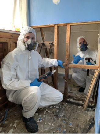 CSS staff in full PPE carrying out mould removal
